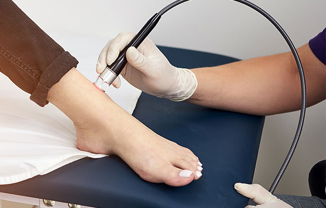 Patient undergoing Cold Laser Therapy at Harbor Health Center