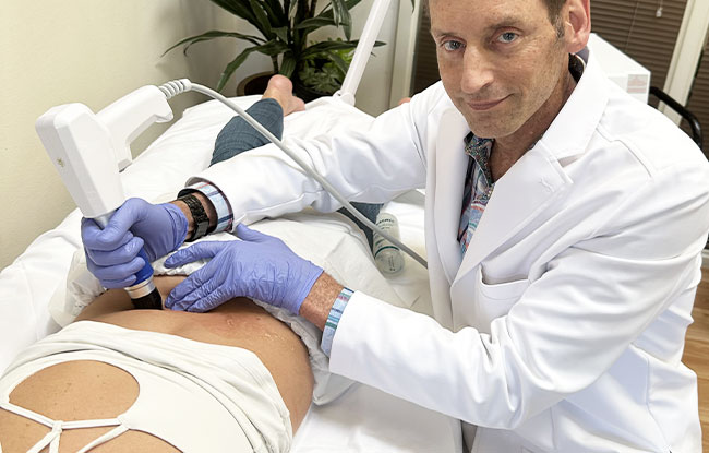 Patient undergoing Shockwave Therapy at Harbor Health Center